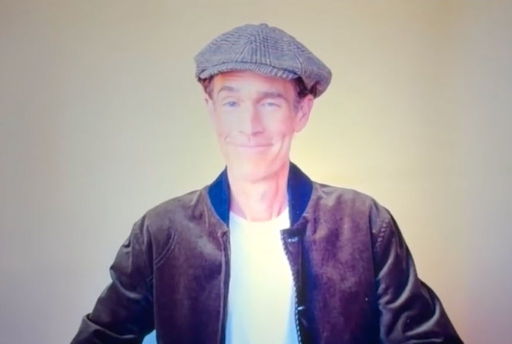 James Van Der Beek smiling and winking.