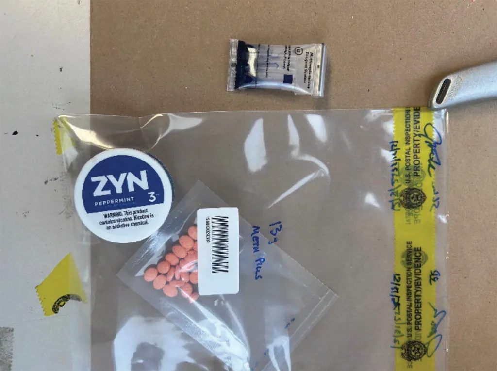 Evidence bag containing orange pills labeled 