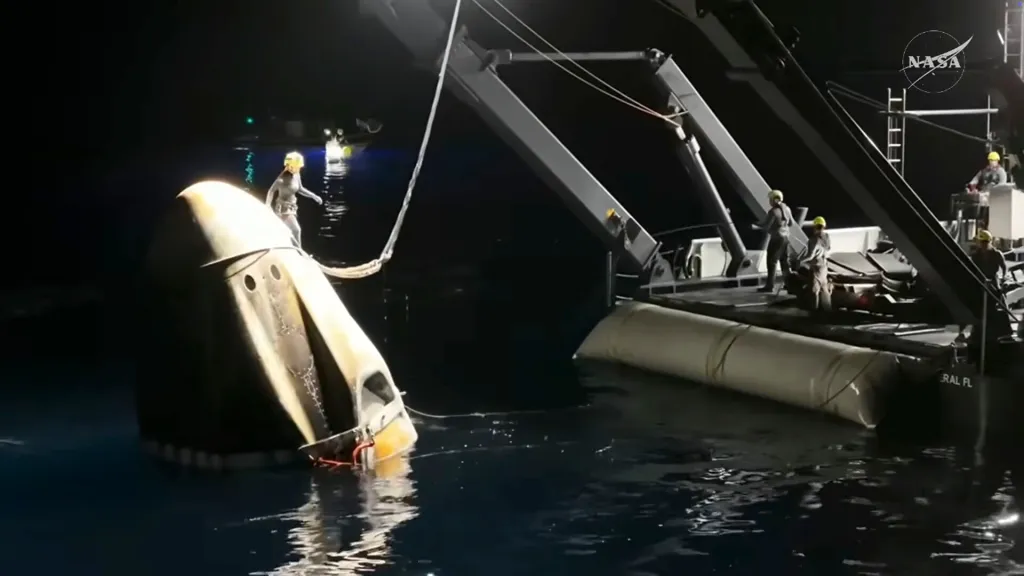 This screengrab from video provided by NASA shows the NASA's SpaceX Crew-11 capsule being taken into the recovery vessel after crew members re entered the earth in a middle-of-the-night splashdown near San Diego, Calif., Thursday, Jan. 15, 2026.