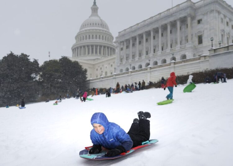 Washington’s snowy morning turns to sleet and freezing rain