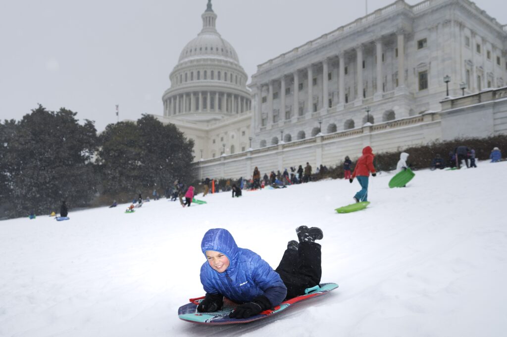 Washington’s snowy morning turns to sleet and freezing rain
