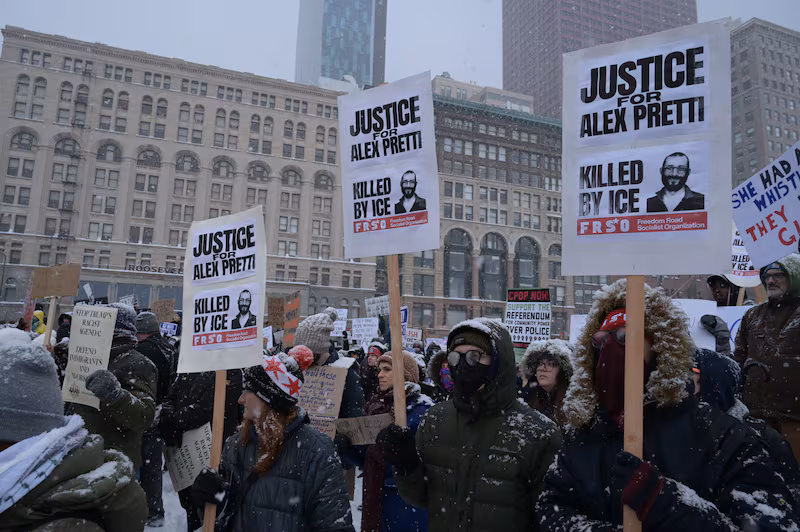 Demonstrators gather in a heavy snowstorm on Michigan Avenue to protest against U.S. Immigration and Customs Enforcement (ICE) and Customs and Border Protection (CBP) in Chicago, US on January 25, 2026.