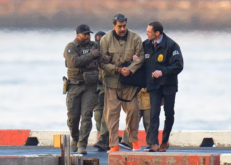 Nicolas Maduro is seen in handcuffs after landing at a Manhattan helipad, escorted by heavily armed Federal agents on January 5, 2026 in New York City.