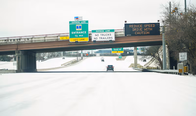 hildren sled down a hill at Doss Elementary following a winter storm that brought rain, sleet, and freezing temperatures to North Austin.