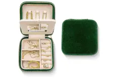 A side by side of a green velvet jewelry organizer, one open and one closed.