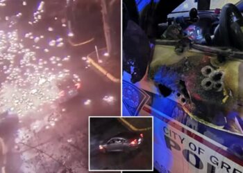 Video shows police officer ambushed in patrol car in explosion of gunfire; suspect found dead after shootout