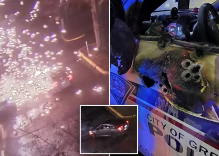 Video shows police officer ambushed in patrol car in explosion of gunfire; suspect found dead after shootout