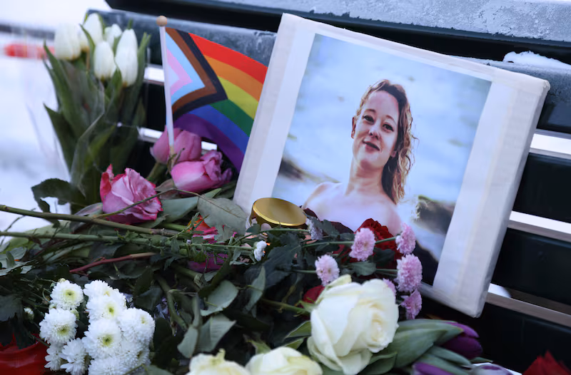Flowers and candles are seen at a vigil for Renee Nicole Good who was shot dead in Minneapolis by ICE agents.