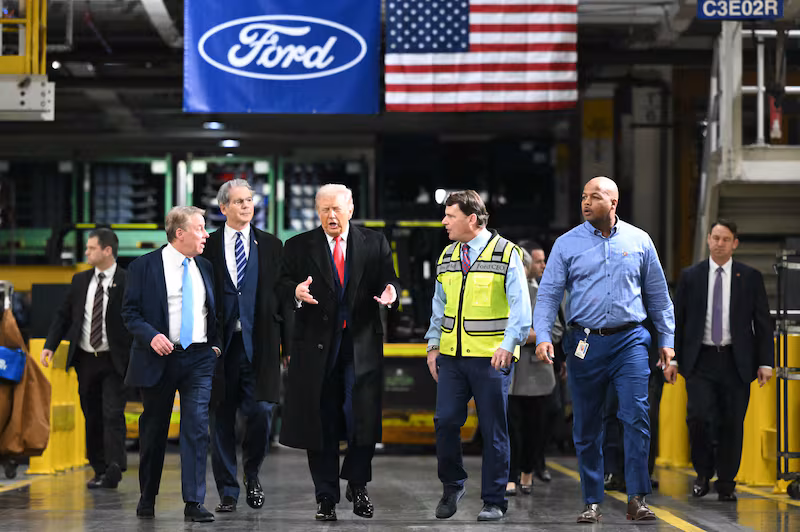 US President Donald Trump, alongside L/R Ford executive chairman Bill Ford, Secretary of Treasury Scott Bessent, Ford CEO Jim Farley, and plant manager Corey Williams, tours Ford Motor Company's River Rouge complex in Dearborn, Michigan on January 13, 2026. (Photo by Mandel NGAN / AFP via Getty Images)