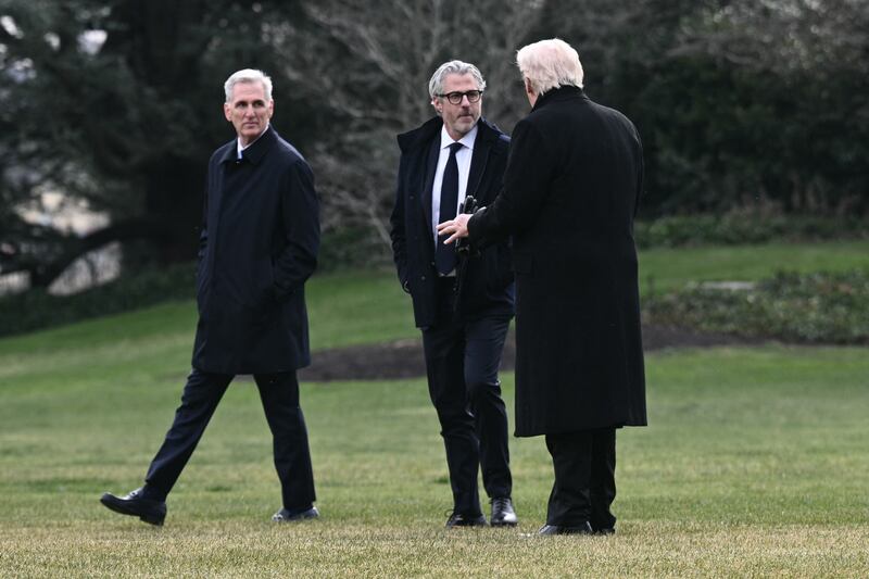 US President Donald Trump speaks with LA 2028 Chairman Casey Wasserman (C) and former US House Speaker Kevin McCarthy (L) before boarding Marine One as he departs from the South Lawn of the White House in Washington, DC, on December 17, 2025.
