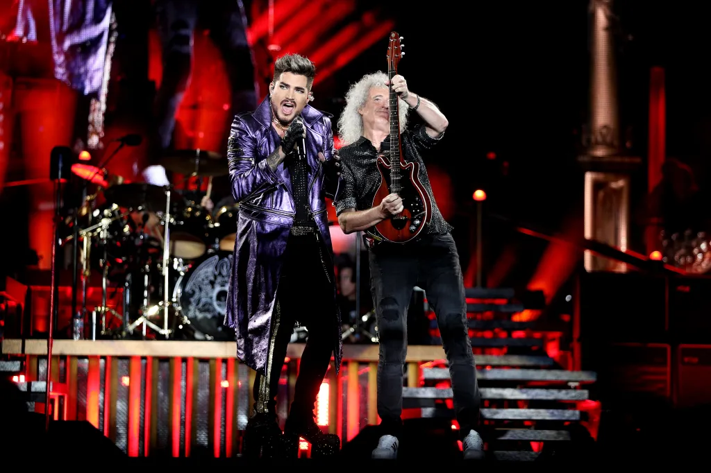 Adam Lambert performs alongside Brian May of Queen at ANZ Stadium on February 15, 2020 in Sydney, Australia.