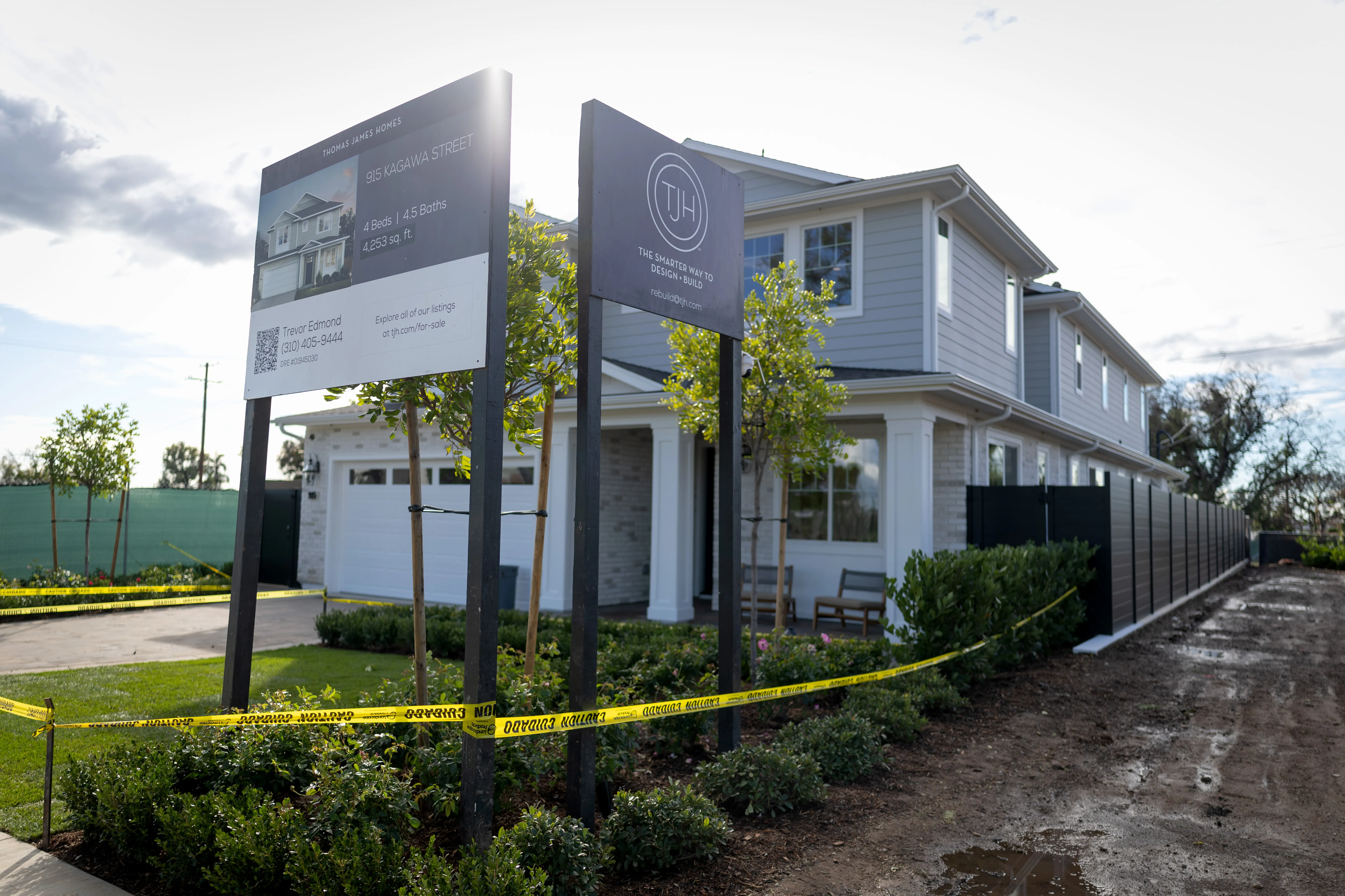A rebuilt home with caution tape around it A rebuilt home with caution tape around it