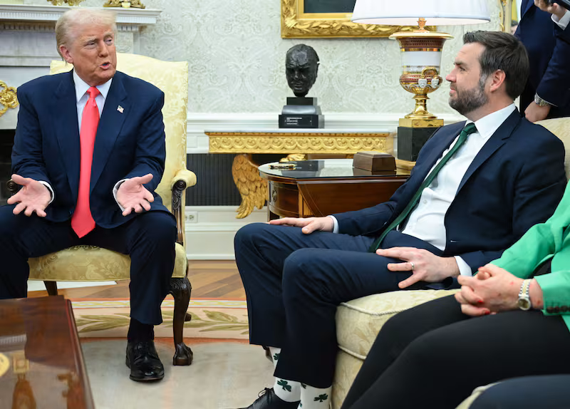 US President Donald Trump speaks to reporters as he meets with Irish Prime Minister Micheal Martin in the Oval Office of the White House in Washington, DC, on March 12, 2025. Looking on from the couch, L-R, are US Vice President JD Vance and White House Chief of Staff Susie Wiles. (Photo by Mandel NGAN / AFP) (Photo by MANDEL NGAN/AFP via Getty Images)