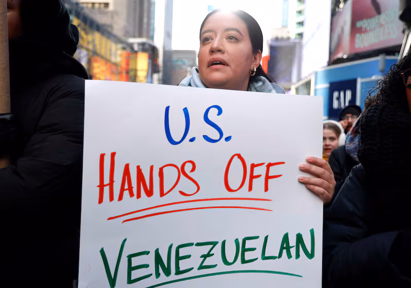 Protesters against US military action in Venezuela flocked to Times Square on Saturday.