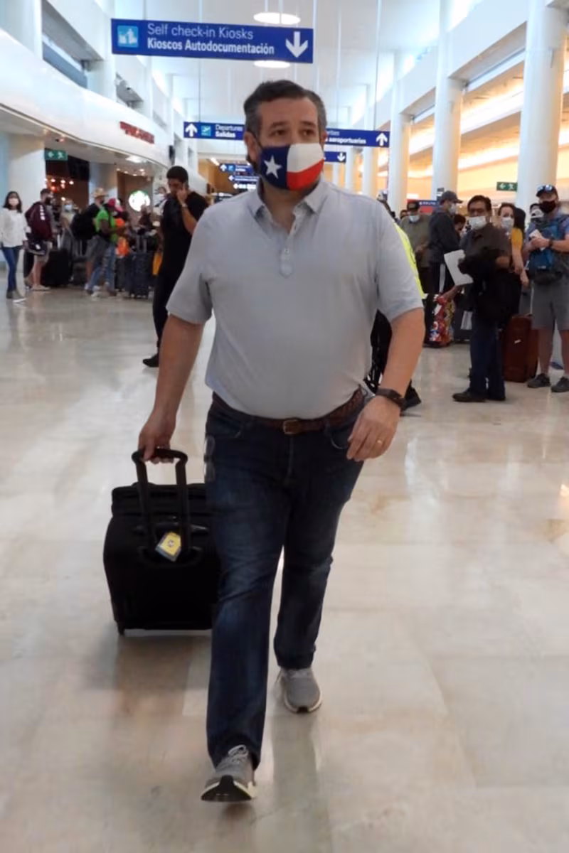 Ted Cruz checks in for a flight at Cancun International Airport after a backlash over his family vacation on Feb. 18, 2021.