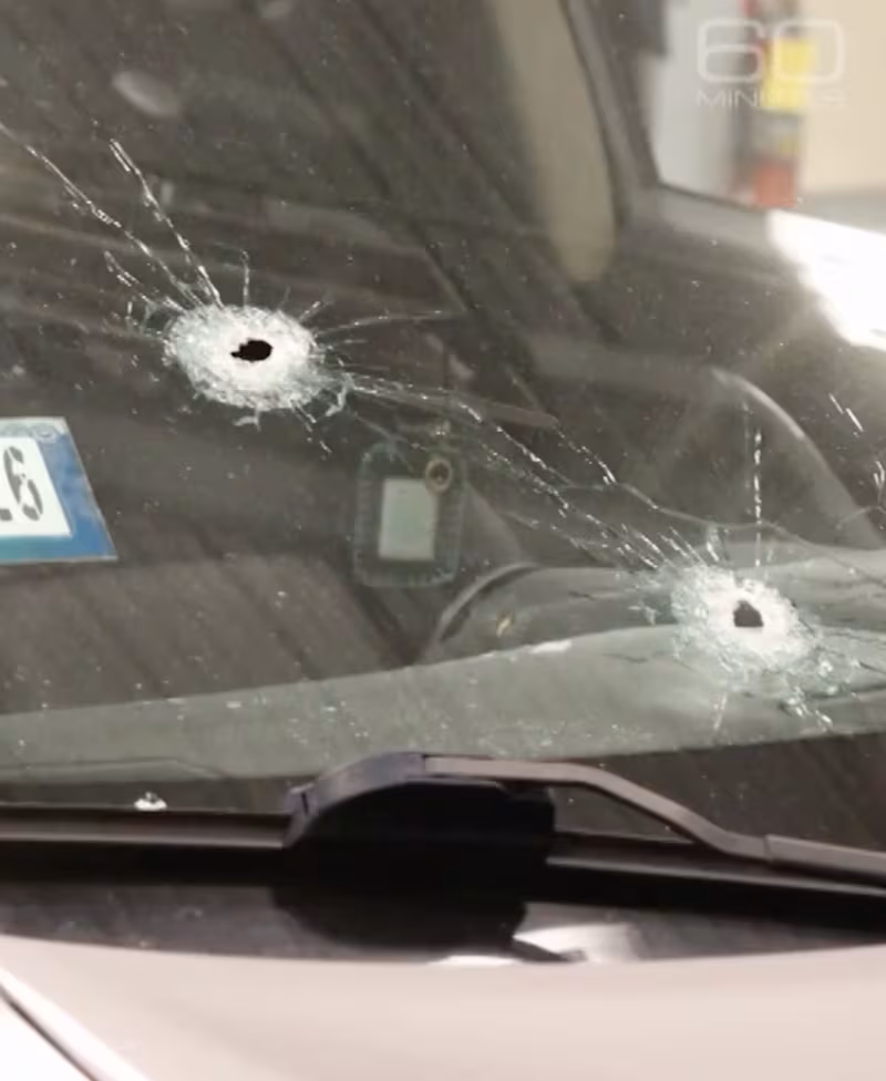Two of the bullet holes in the windshield of Marimar Martinez's car.