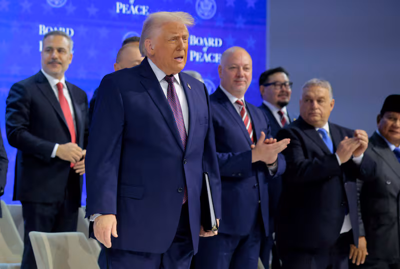 DAVOS, SWITZERLAND - JANUARY 22: U.S. President Donald Trump presents the “Board of Peace” onstage at the World Economic Forum (WEF) on January 22, 2026 in Davos, Switzerland. The annual meeting of political and business leaders comes amid rising tensions between the United States and Europe over a range of issues, including Trump's vow to acquire Greenland, a semi-autonomous Danish territory. (Photo by Chip Somodevilla/Getty Images)