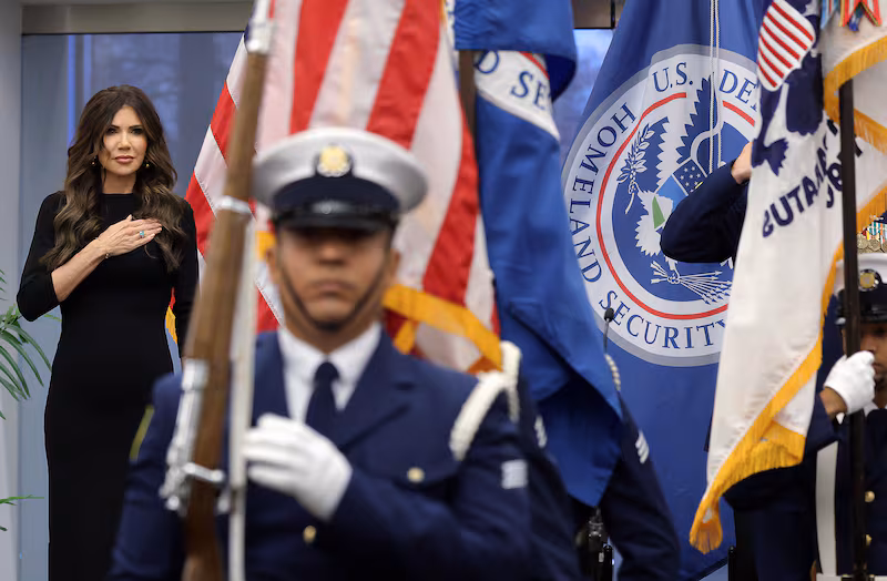 Secretary of Homeland Security Kristi Noem stands for the presentation of colors during a ceremony at the U.S. Coast Guard Headquarters on January 15, 2026 in Washington, D.C.
