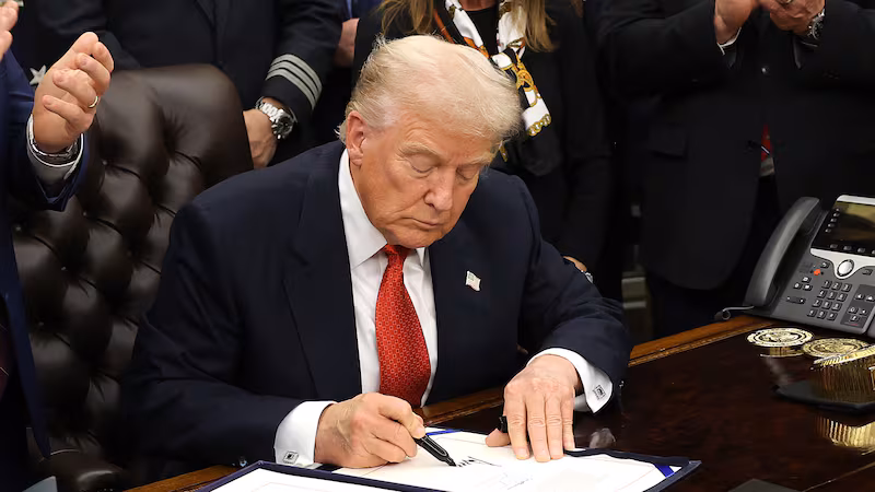 WASHINGTON, DC - NOVEMBER 12: U.S. President Donald Trump signs funding legislation to reopen the federal government as he is joined by House Minority Leader Steve Scalise (R-LA), House Speaker Mike Johnson (R-LA), Republican lawmakers and business leaders, during a ceremony in the Oval Office of the White House on November 12, 2025, in Washington, DC. The legislation, passed by the House of Representatives tonight, funds the federal government until the end of January 2026 and ends the 43-day government shutdown, the longest in the nation’s history. (Photo by Win McNamee/Getty Images)