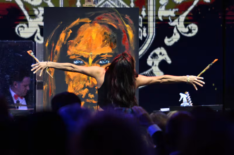 Christian speed artist Vanessa Horabuena paints a Jesus art piece during the New Year's Eve Party hosted by US President Donald Trump at his Mar-a-Lago residence in Palm Beach, Florida on December 31, 2025.