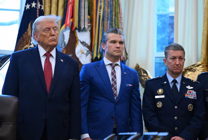 President Donald Trump, Defense Secretary Pete Hegseth and Chairman of the Joint Chiefs of Staff Gen. Dan Caine in the Oval Office of the White House in Washington, DC, on December 15, 2025.