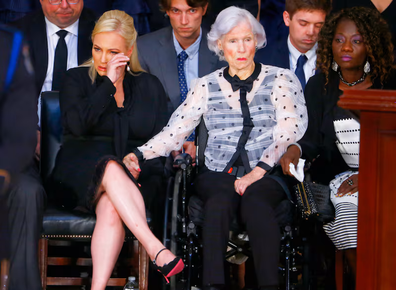McCain cries at her father's funeral.