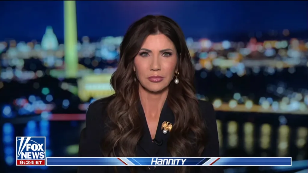 Kristi Noem speaking on Hannity, with a cityscape in the background.