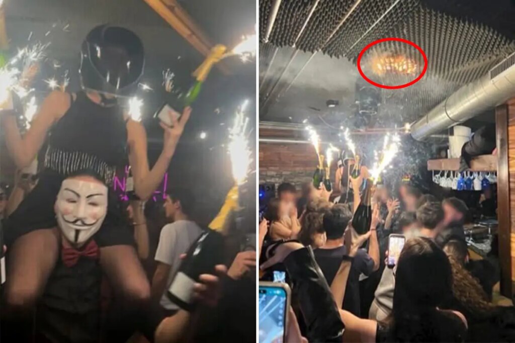 Haunting photo shows revelers waving flaming champagne bottles as Swiss nightclub roof catches fire