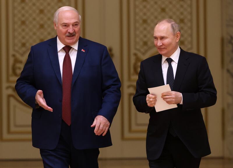 Russian President Vladimir Putin and Belarussian President Alexander Lukashenko enter the hall during their meeting at the Palace of Independence,  on May 24, 2024, in Minsk, Belarus.