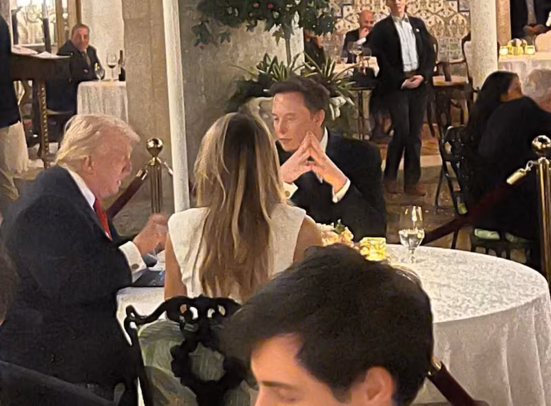 Eloin Musk, Donald Trump, and Melania Trump sat around a table.