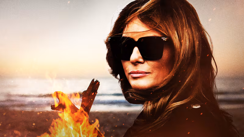 Melania enjoying a warm bonfire.