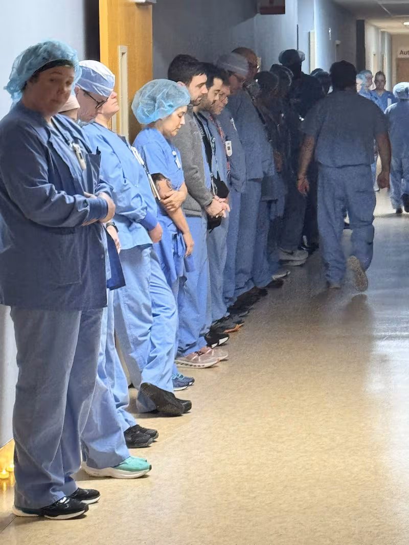 Alex Pretti's colleagues hold a moment a moment of silence at Minneapolis VA Health Care System hospital, in Minneapolis, Minnesota.