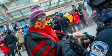 100 clergy arrested at airport protest as Minnesotans strike against ICE