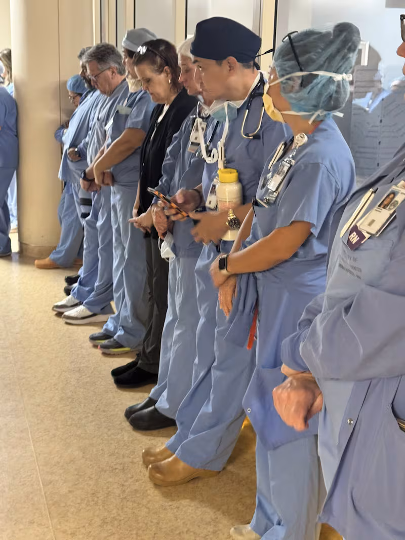 Alex Pretti's colleagues hold a moment a moment of silence at Minneapolis VA Health Care System hospital, in Minneapolis, Minnesota.
