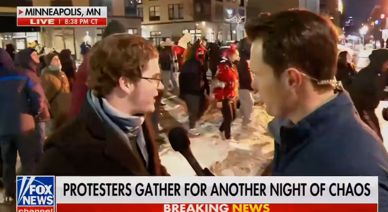 Garrett Tenney interviewing a Minneapolis anti-ICE protester on January 9.