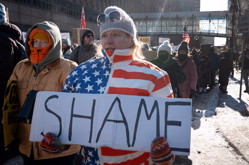 Demonstrators march through downtown protesting ICE operations and the death of Renee Good and Alex Pretti on January 25, 2026 in Minneapolis, Minnesota.