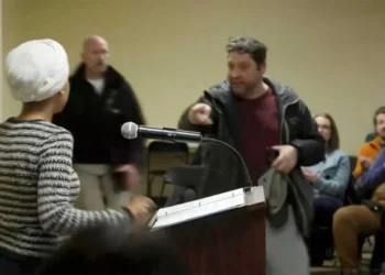 Man charges Ilhan Omar at podium and sprays her with mystery substance during town hall