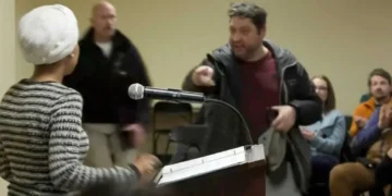 Man charges Ilhan Omar at podium and sprays her with mystery substance during town hall