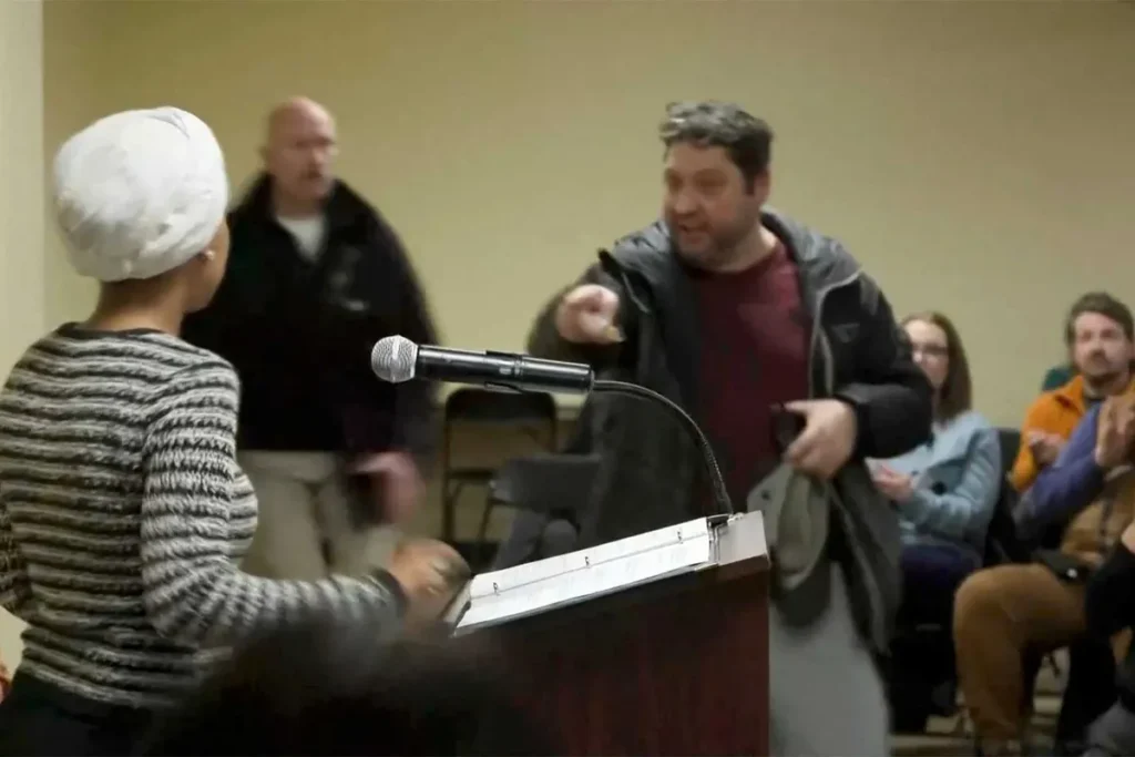 Man charges Ilhan Omar at podium and sprays her with mystery substance during town hall