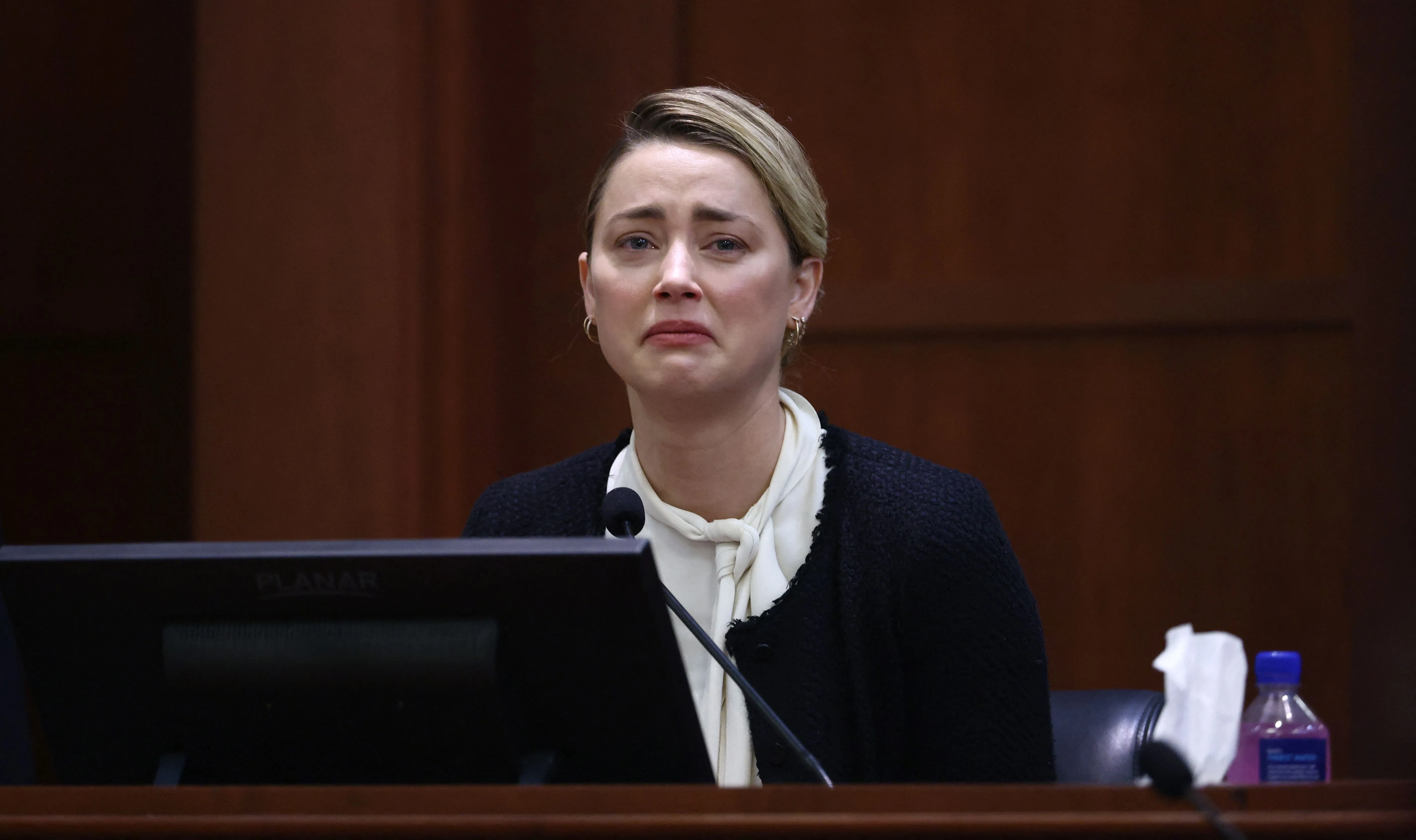 Amber Heard crying during her testimony at Fairfax County Circuit Courthouse.