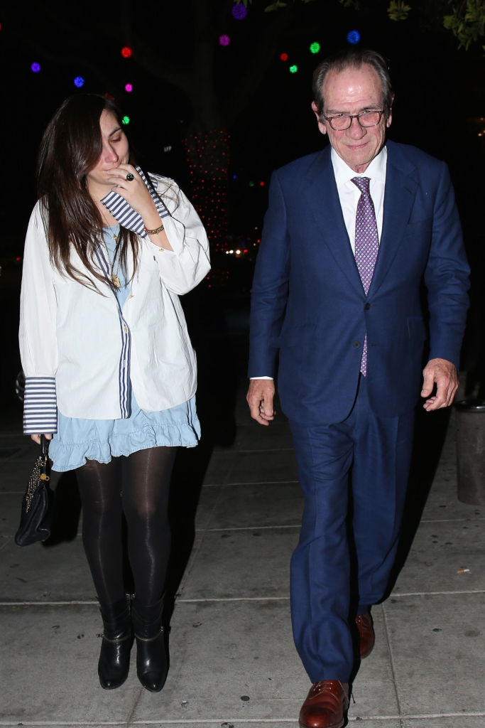 Tommy Lee Jones and daughter Victoria Jones walking together.