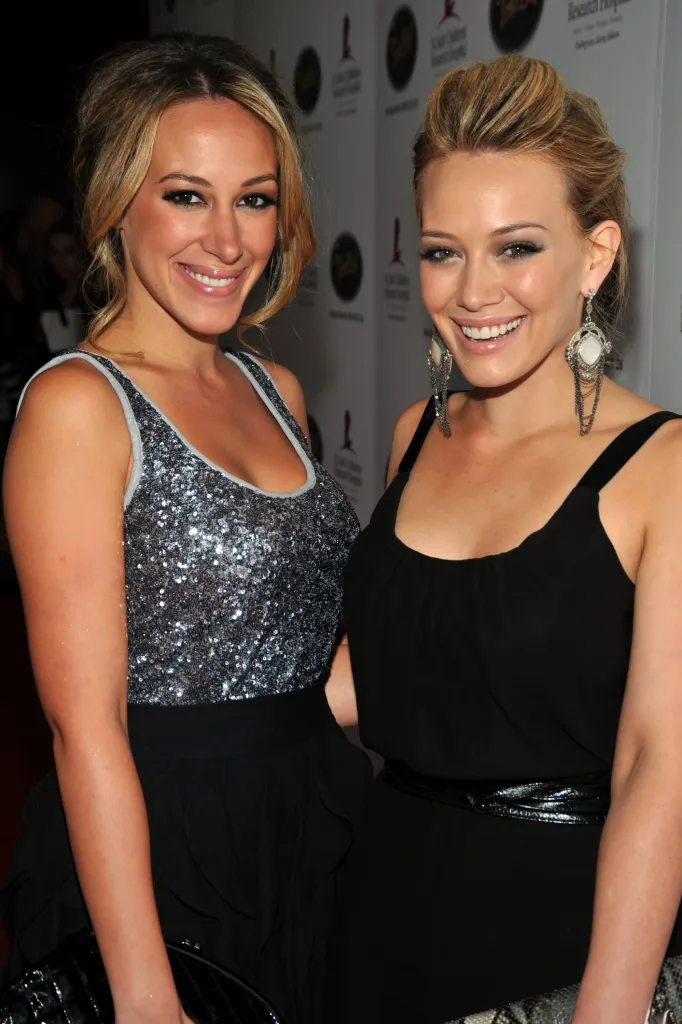 Actors Haylie Duff and Hilary Duff smiling.