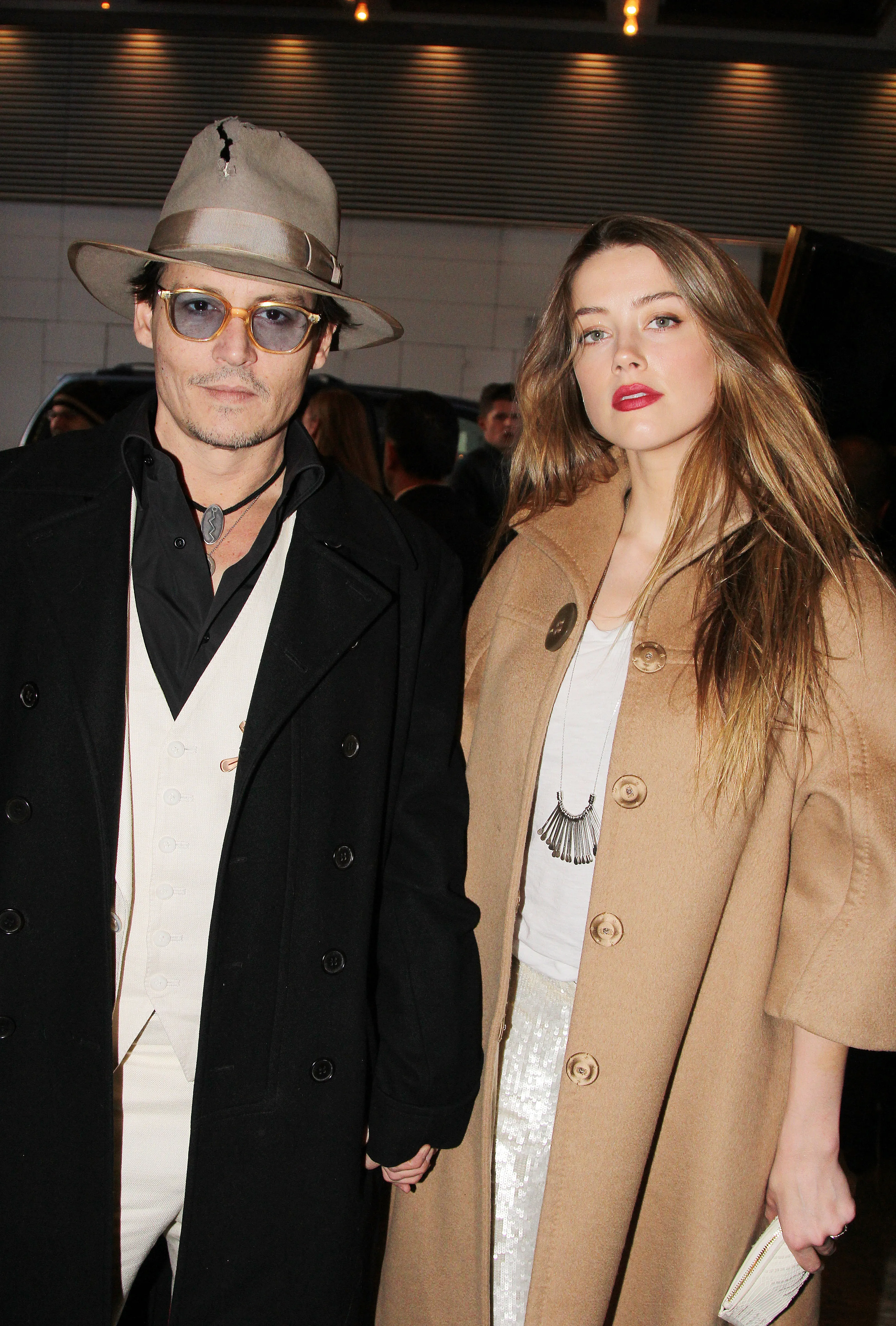 Johnny Depp and Amber Heard posing together at the opening night of 
