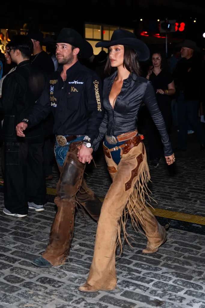Adan Banuelos and Bella Hadid, both wearing cowboy hats and western attire, attend the