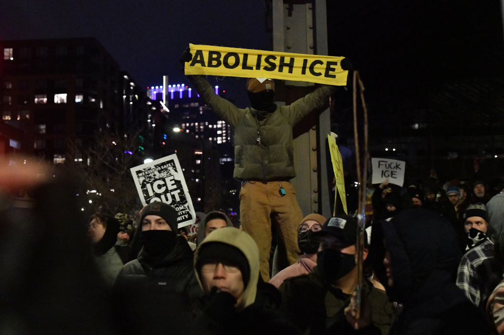 Protesters flood the streets of Minneapolis near a hotel believed to be housing federal agents on Jan. 9, 2026.