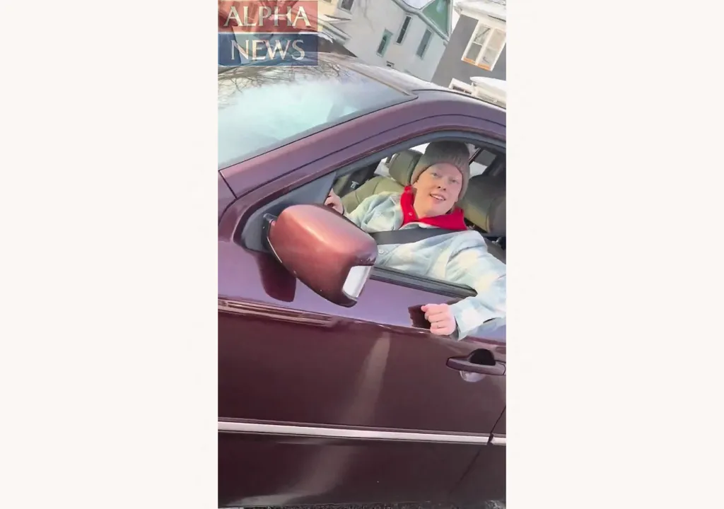 Renee Nicole Good, an American woman, looking out of a car window, moments before she was shot by an ICE agent.