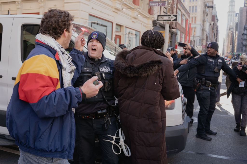 NYPD clear protestors that confronted Immigration and Customs Enforcement (ICE) agents before an attempted sweep on Canal Street in Manhattan. ICE has cracked down on vendors selling counterfit goods in New York City.