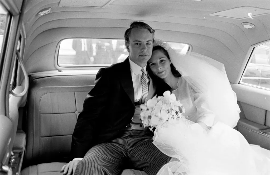 Amanda Jay Mortimer and S. Carter Burden, Jr. on their wedding day in a car.