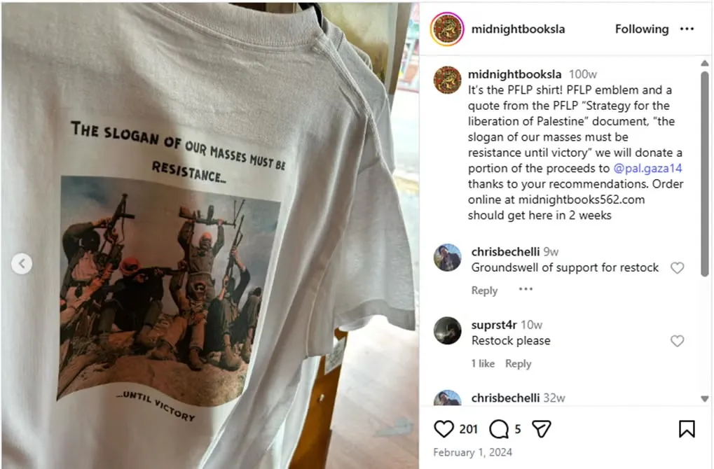 A white t-shirt featuring armed figures and the text 