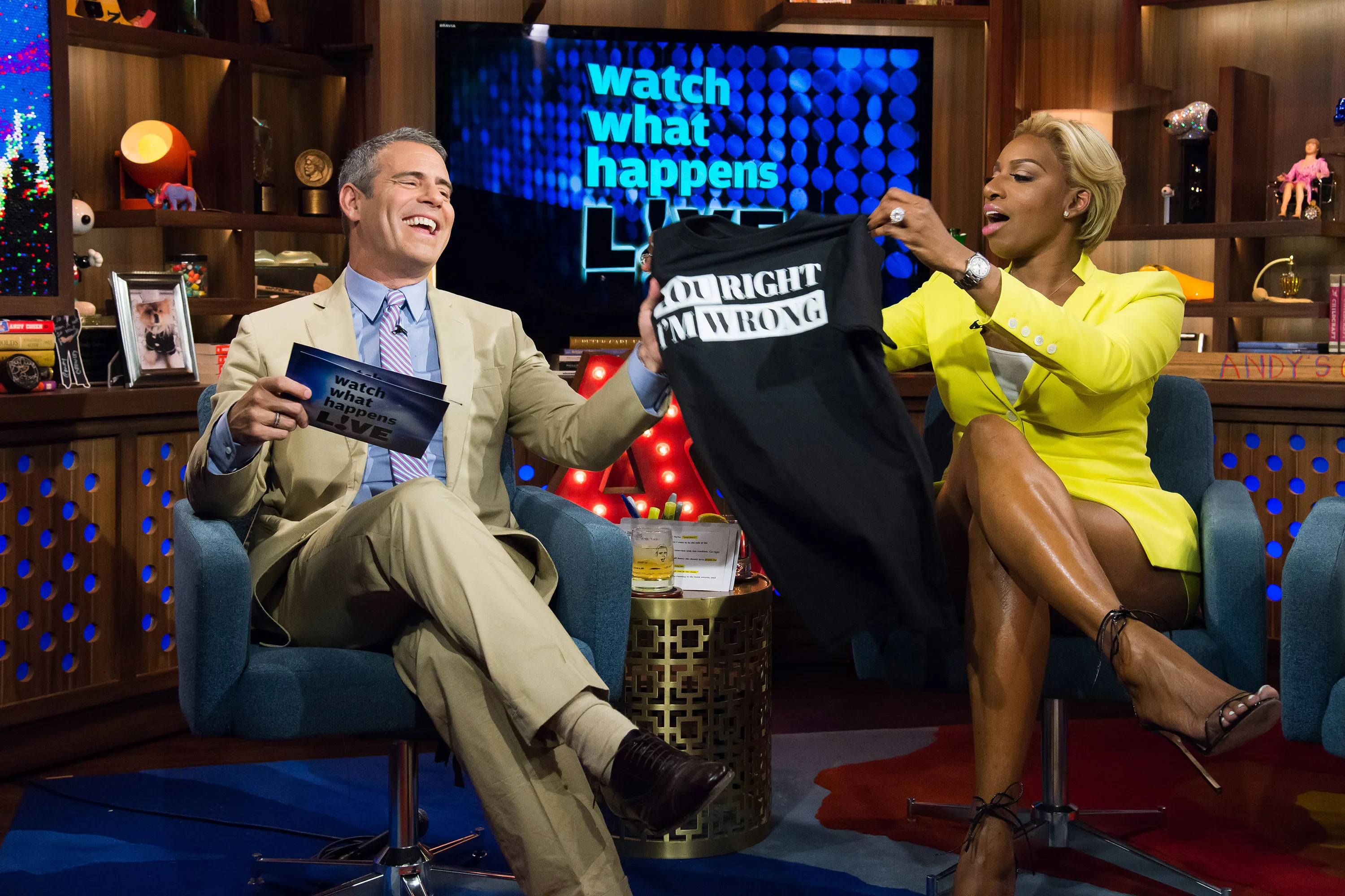 Andy Cohen and NeNe Leakes laugh on the set of *Watch What Happens Live*.